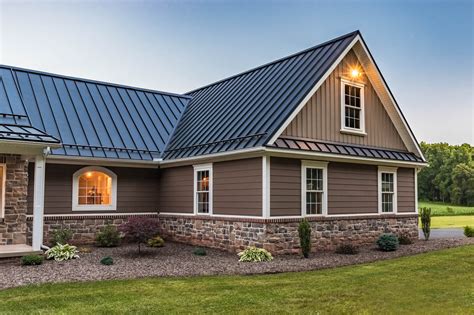 brown house with black metal roof|houses with black shingle roofs.